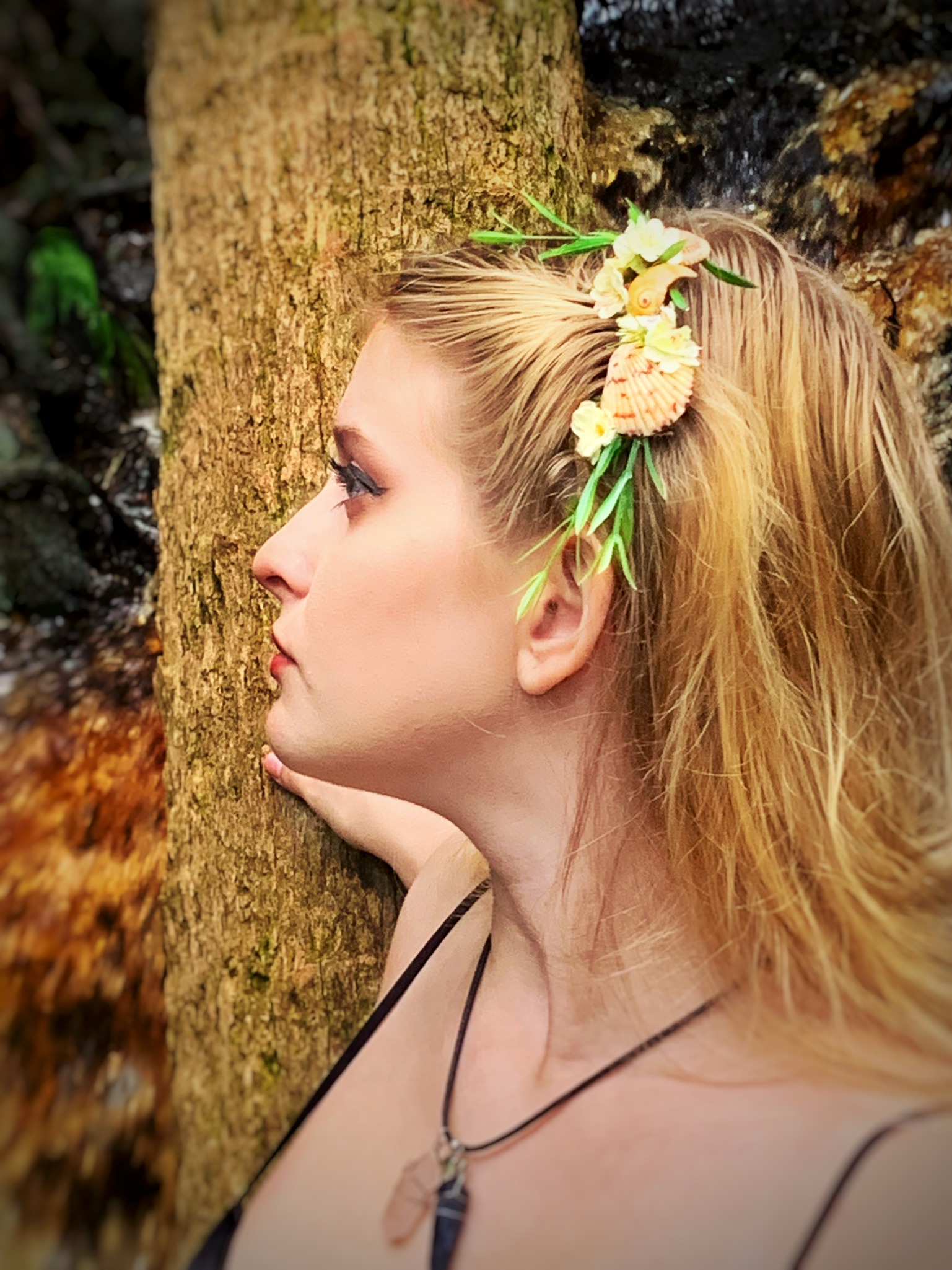 Girl wearing shell hair comb.