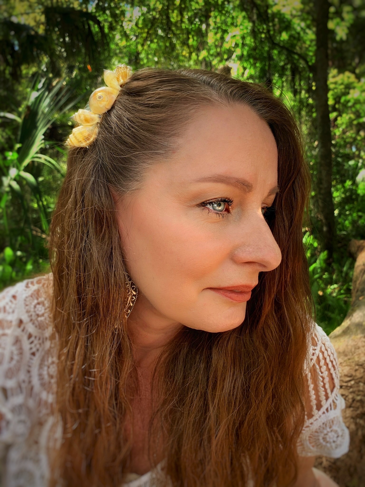 Artist wearing shell hair comb